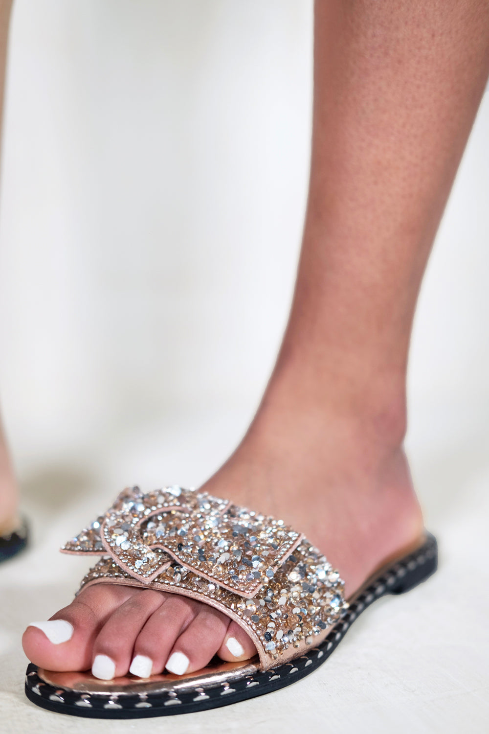 LORNA WIDE FIT DIAMANTE BOW FLAT SLIDERS WITH STUD DETAILS IN ROSE GOLD