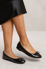 BEXLEY SLIP ON FLAT PUMPS IN BLACK PATENT FAUX LEATHER