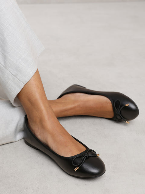 BEXLEY SLIP ON FLAT PUMPS IN BLACK FAUX LEATHER