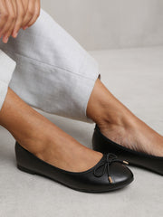 BEXLEY SLIP ON FLAT PUMPS IN BLACK FAUX LEATHER