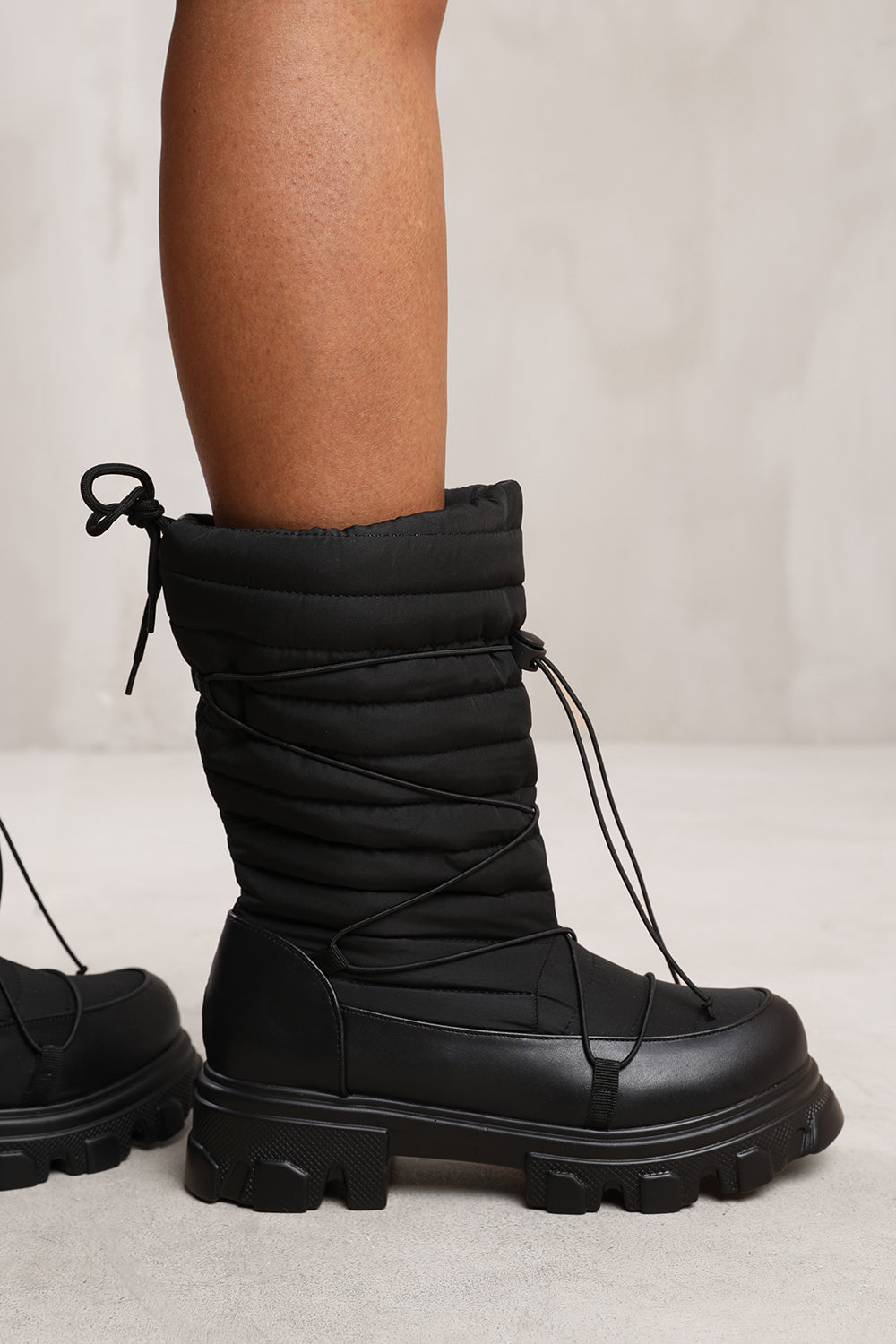 ROSIE PUFFER QUILTED BOOT WITH CHUNKY SOLES IN BLACK