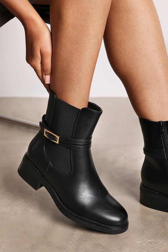 Quilla Ankle Boot with Gold Buckle Detail in Black Faux Leather