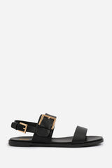 CAMILLA CLASSIC FLAT SANDALS WITH STRAP AND BUCKLE DETAIL IN BLACK FAUX LEATHER