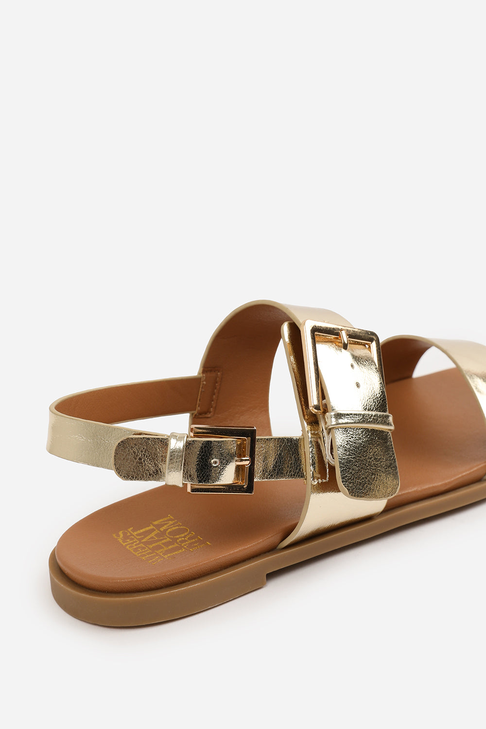 CAMILLA WIDE FIT CLASSIC FLAT SANDALS WITH STRAP AND BUCKLE DETAIL IN GOLD METALLIC FAUX LEATHER