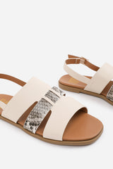 UMA WIDE FIT FLAT SANDALS WITH MULTI STRAP DETAIL AND BUCKLE CLOSURE IN CREAM