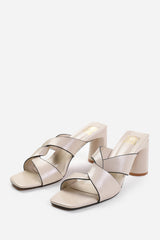 MANILA TWIST OVER STRAP BLOCK HEEL MULES IN BEIGE FAUX LEATHER