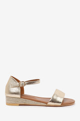 ELEANOR LOW WEDGE SHOES WITH ADJUSTABLE ANKLE STRAP IN GOLD METALLIC FAUX LEATHER