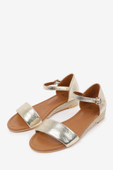 ELEANOR WIDE FIT LOW WEDGE SHOES WITH ADJUSTABLE ANKLE STRAP IN GOLD METALLIC FAUX LEATHER