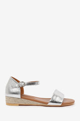 ELEANOR WIDE FIT LOW WEDGE SHOES WITH ADJUSTABLE ANKLE STRAP IN SILVER METALLIC FAUX LEATHER