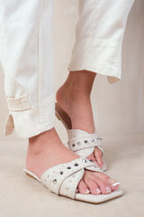 SATURN DOUBLE CROSS OVER STRAP FLAT SANDALS WITH STUD DETAILS IN NUDE FAUX LEATHER