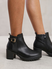 KALI MID BLOCK HEEL WITH BUCKLE DETAIL STRETCH ANKLE BOOTS IN BLACK FAUX LEATHER