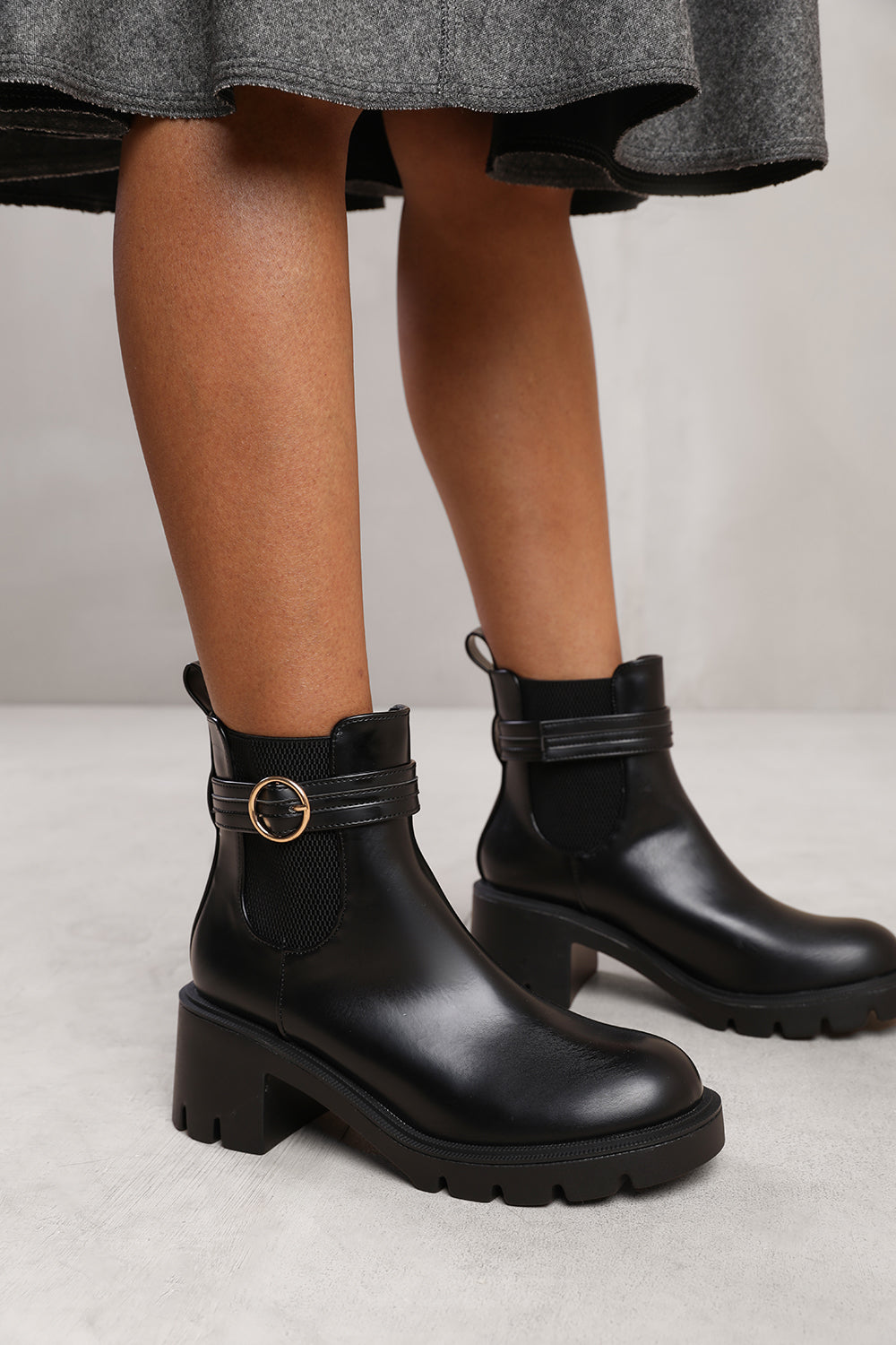 LYRIC ANKLE BOOT WITH CHUNKY SOLE AND BUCKLE DETAIL IN BLACK FAUX LEATHER