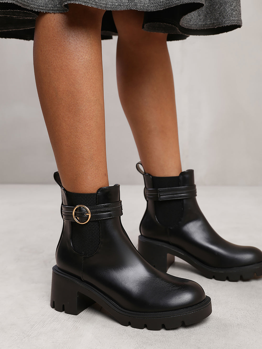 LYRIC ANKLE BOOT WITH CHUNKY SOLE AND BUCKLE DETAIL IN BLACK FAUX LEATHER