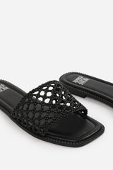 CHELSEA WOVEN STRAP DETAIL FLAT SANDALS IN BLACK FAUX LEATHER