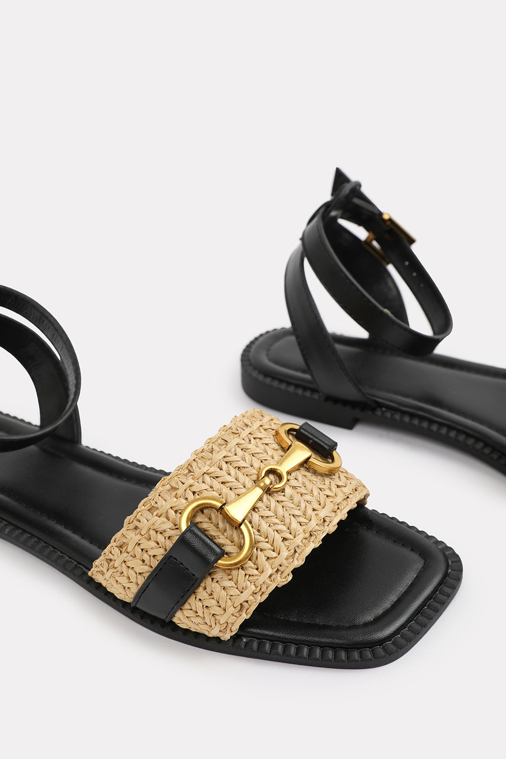 CATELYN PU STRAW DETAIL STRAP SANDALS  WITH BUCKLE CLOSURE IN BLACK FAUX LEATHER