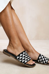 SYCAMORE FLAT SANDALS WITH TEXTURED SINGLE BAND IN BLACK FAUX LEATHER