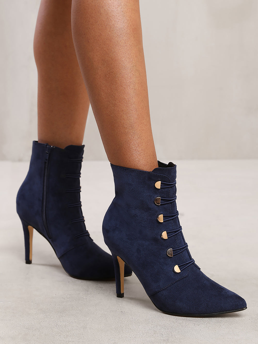 BLYTHE POINTED TOE MID HEEL ANKLE BOOTS WITH GOLD BUTTONS IN NAVY BLUE FAUX SUEDE