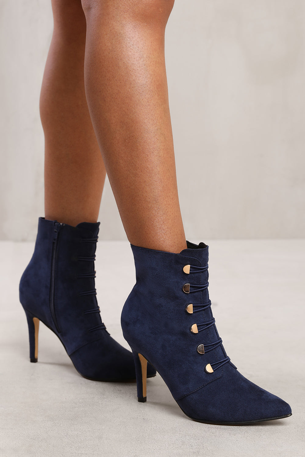 BLYTHE POINTED TOE MID HEEL ANKLE BOOTS WITH GOLD BUTTONS IN NAVY BLUE FAUX SUEDE
