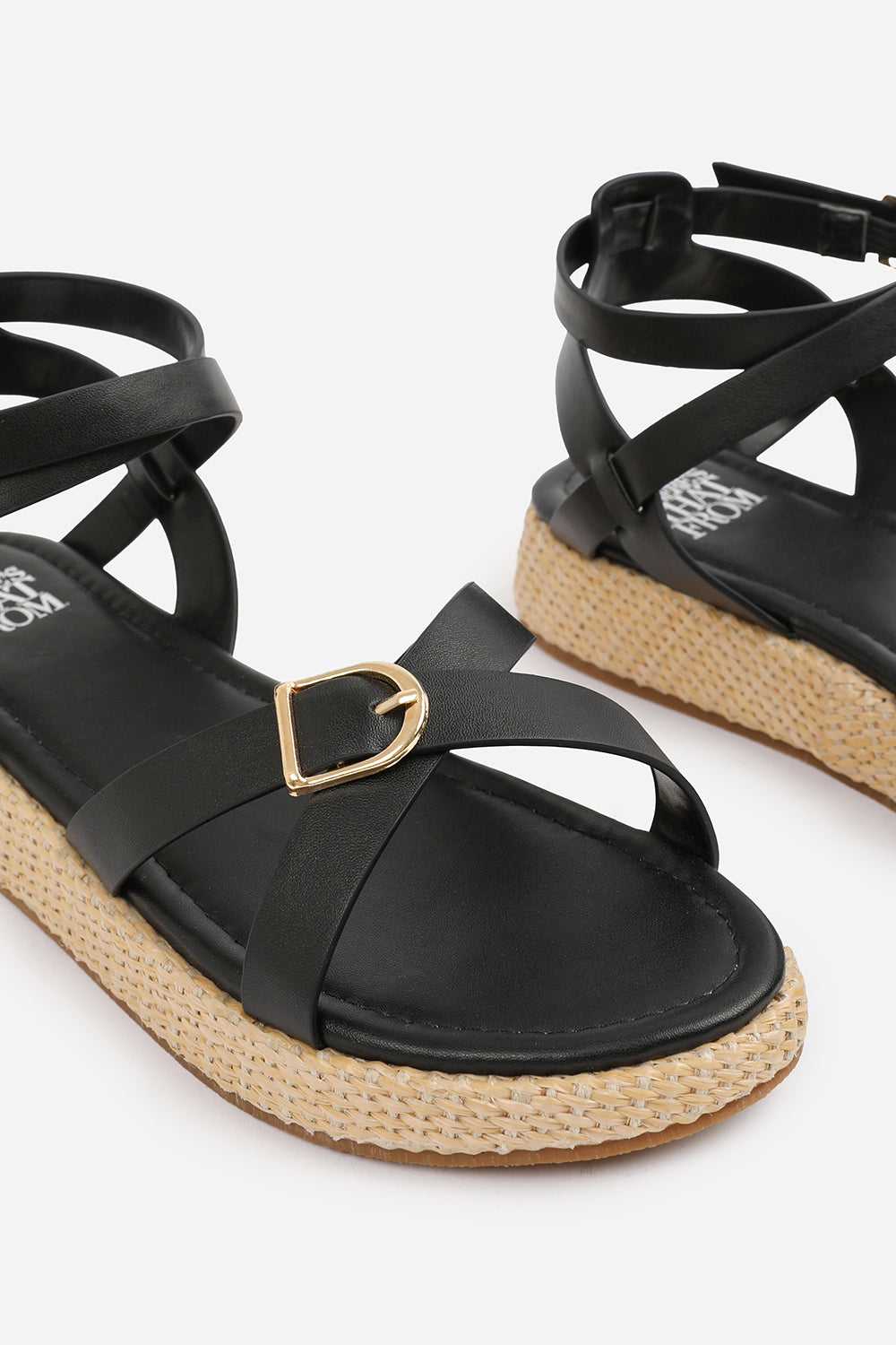 ALORA CROSS OVER BUCKLE STRAP SANDALS IN BLACK FAUX LEATHER