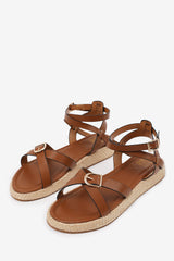 ALORA CROSS OVER BUCKLE STRAP SANDALS IN TAN FAUX LEATHER