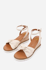 KATARA KNOT DETAIL WEDGE SHOES WITH BUCKLE ANKLE STRAP IN CREAM PU