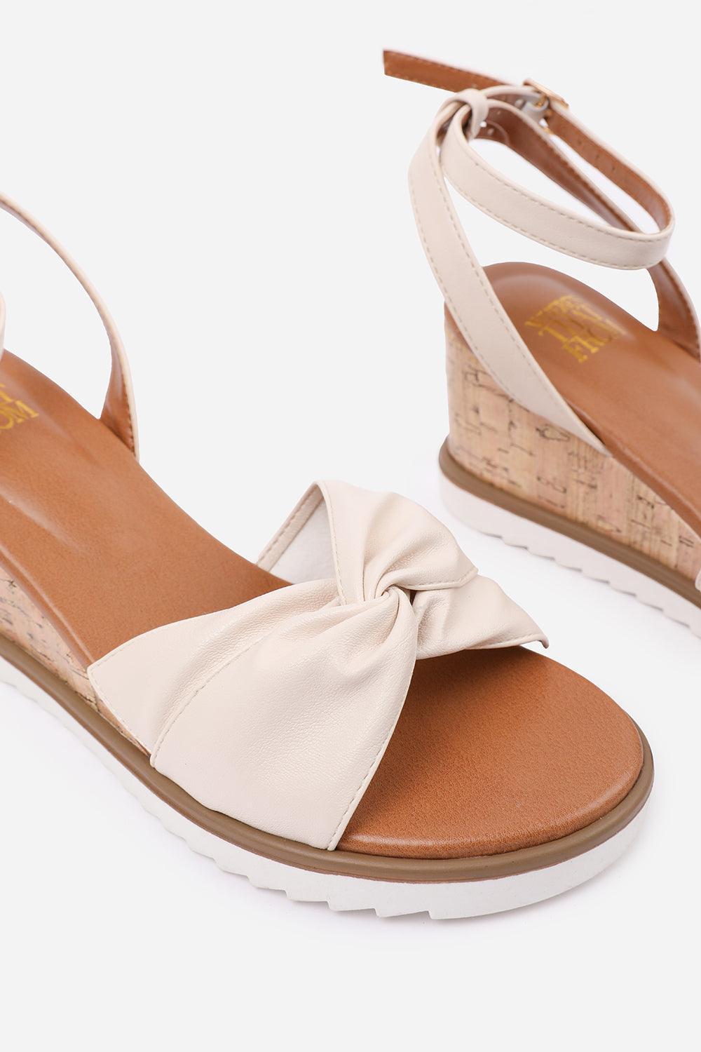 KATARA KNOT DETAIL WEDGE SHOES WITH BUCKLE ANKLE STRAP IN CREAM PU