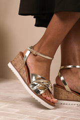 KATARA WIDE FIT KNOT DETAIL WEDGE SHOES WITH BUCKLE ANKLE STRAP IN GOLD METALLIC PU