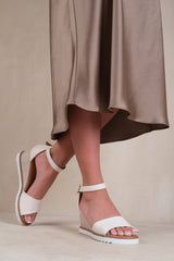 DUSK WEDGE SHOES WITH BUCKLE ANKLE STRAP IN CREAM PU