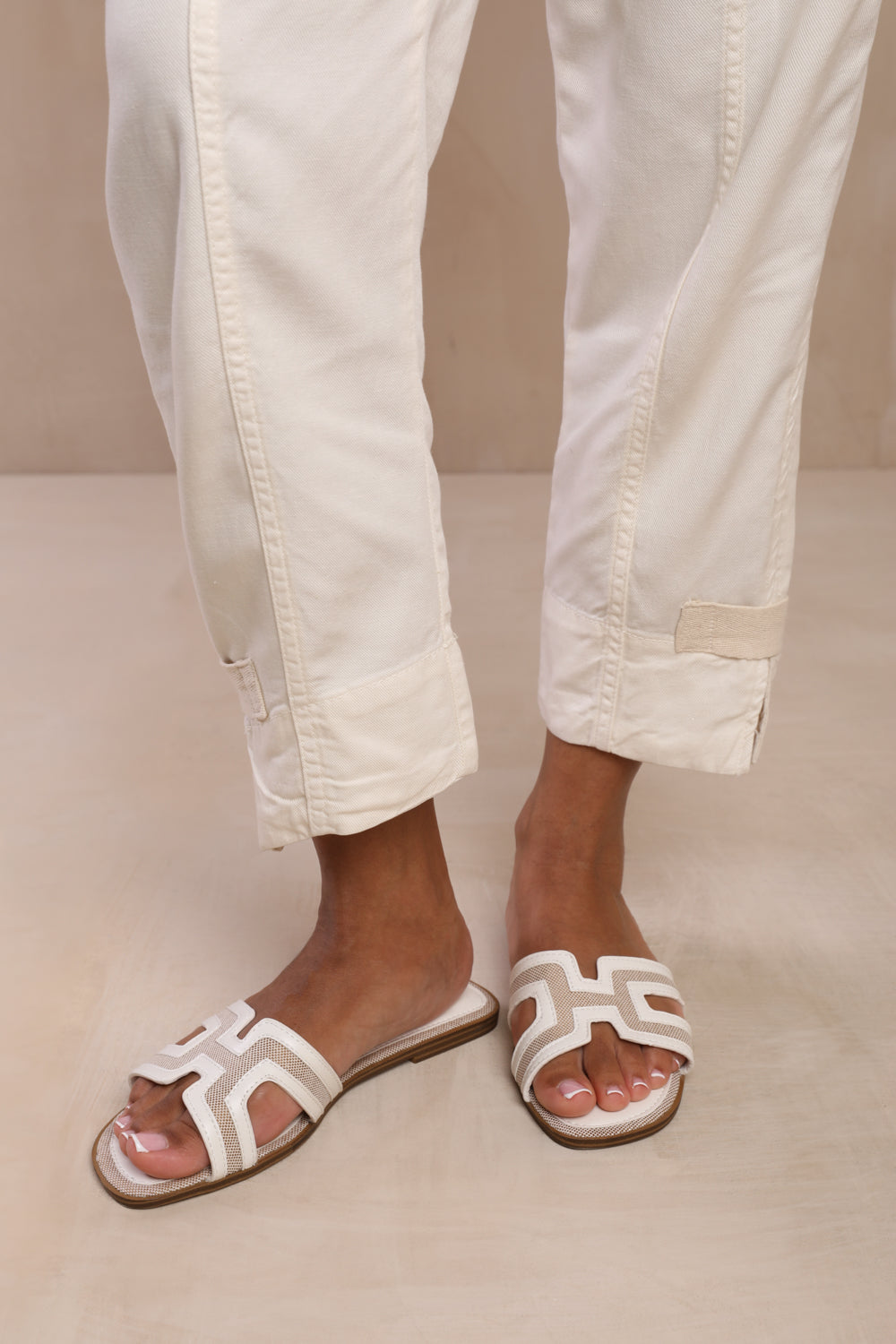 SURGE CUT OUT STRAP FLAT SANDALS IN WHITE FAUX LEATHER