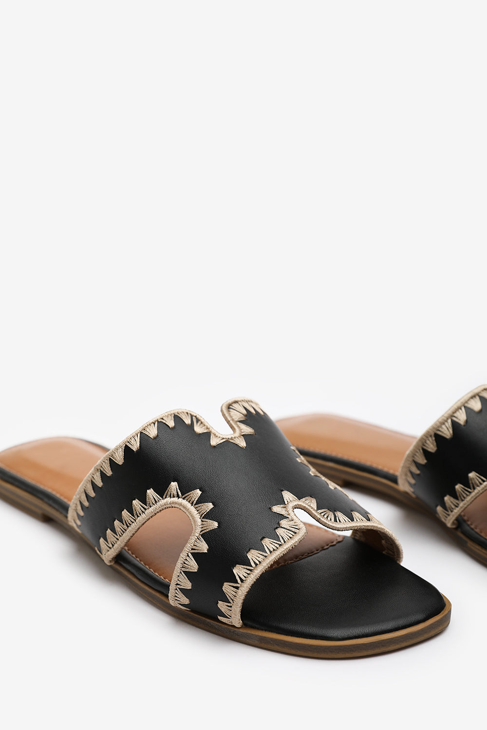 NYOMI CUT OUT STRAP FLAT SANDALS WITH STITCHING DETAIL IN BLACK FAUX LEATHER