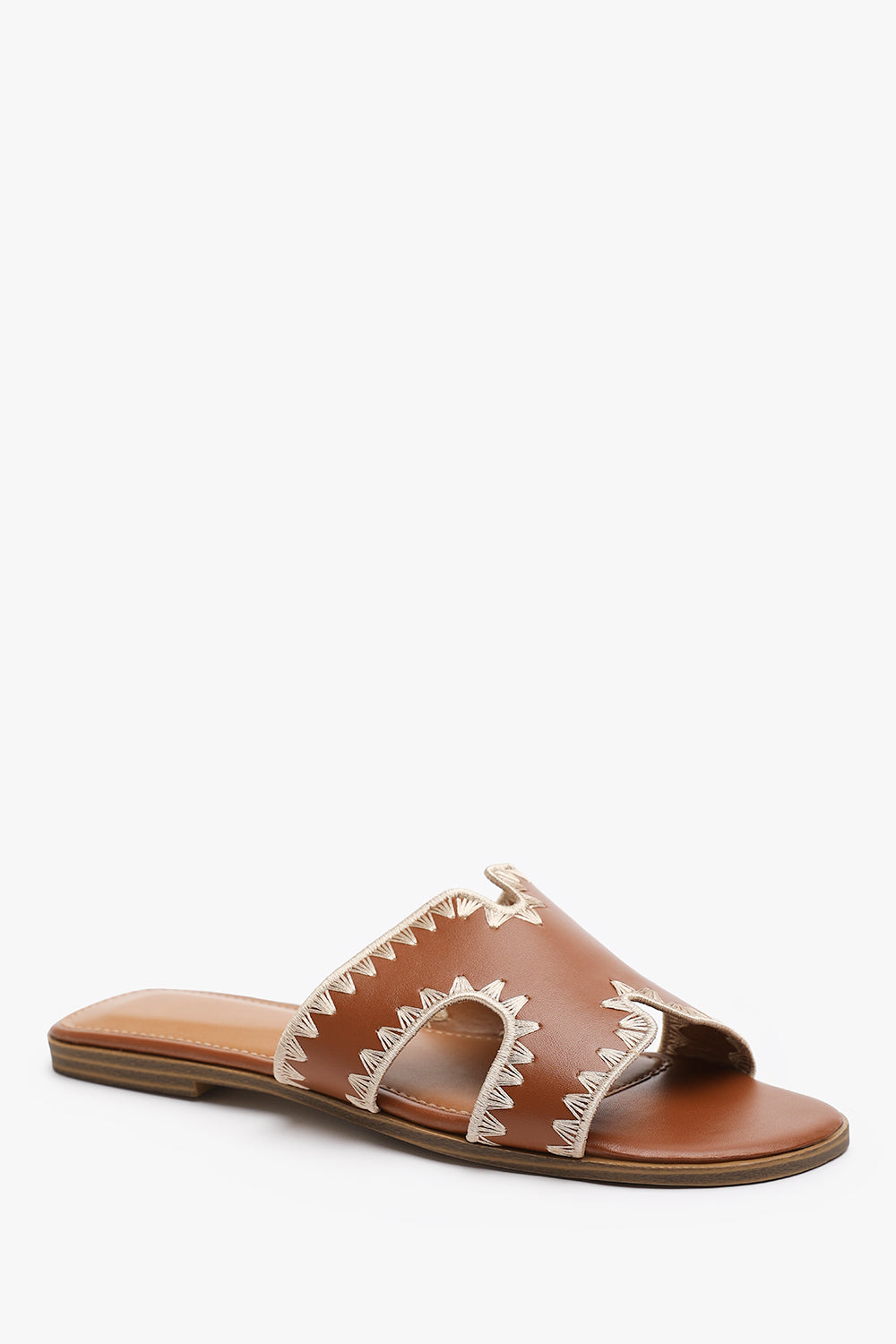 NYOMI CUT OUT STRAP FLAT SANDALS WITH STITCHING DETAIL IN TAN FAUX LEATHER