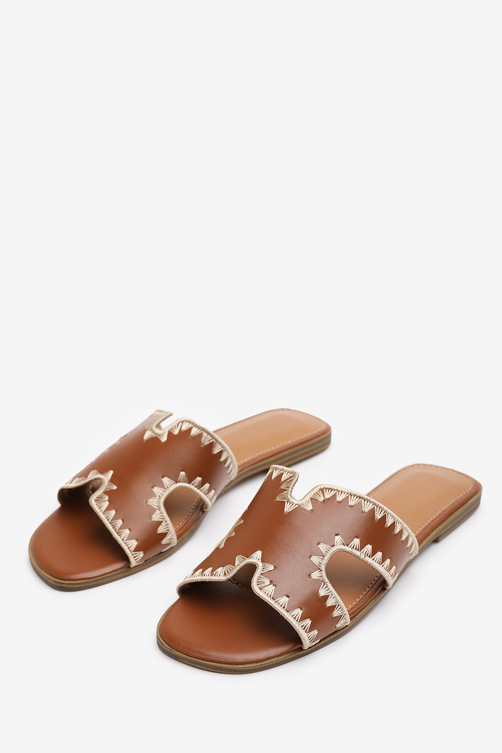 NYOMI CUT OUT STRAP FLAT SANDALS WITH STITCHING DETAIL IN TAN FAUX LEATHER