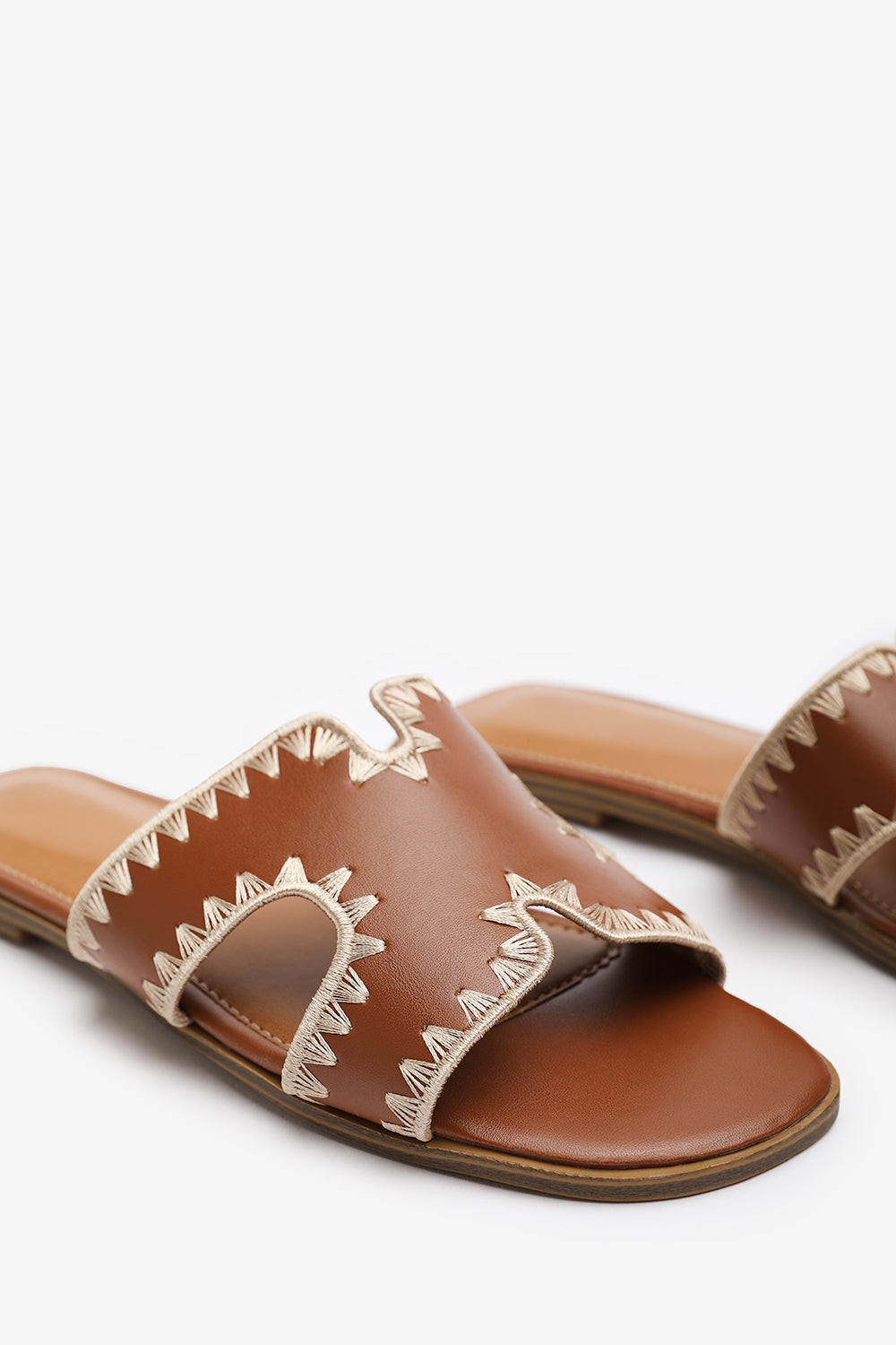 NYOMI CUT OUT STRAP FLAT SANDALS WITH STITCHING DETAIL IN TAN FAUX LEATHER