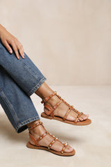 NATALIA STUDDED GLADIATOR SANDALS IN TAN FAUX LEATHER
