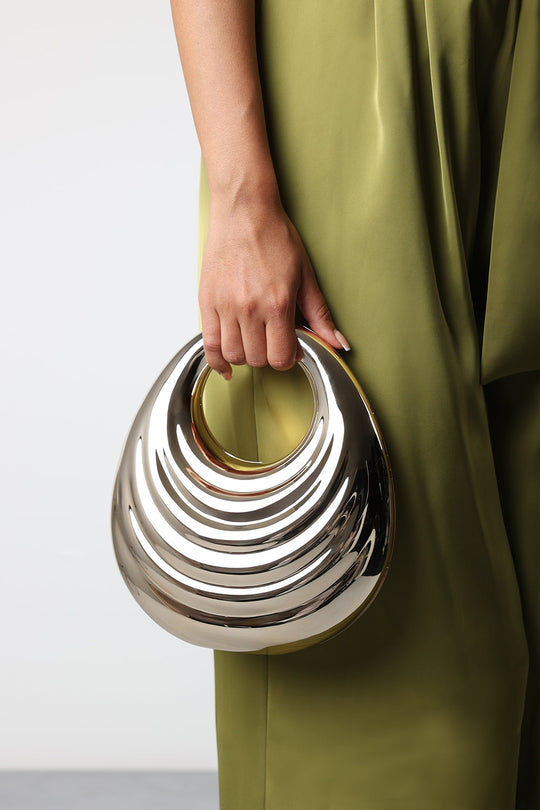 Lagoon Chrome Effect Sculpted Oval Handle Clutch In Gold