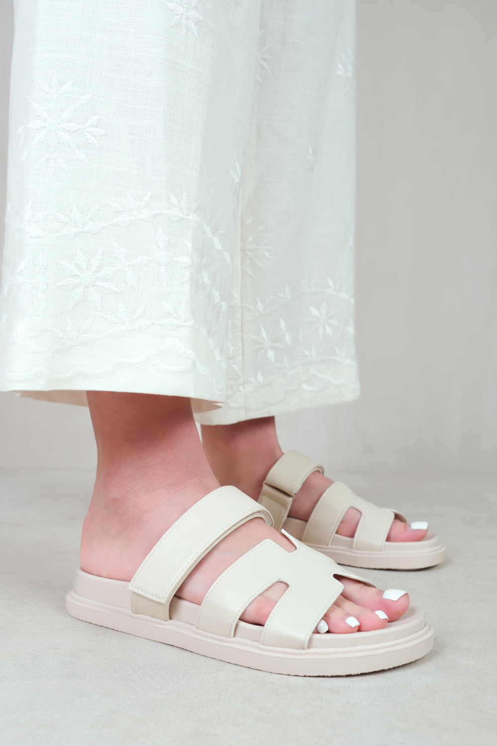 ADAGIO STRAPPY SANDALS IN NUDE FAUX LEATHER