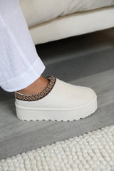 ALLEGRA FLATFORM EMBROIDERED LOW ANKLE SLIPPER BOOTS IN CREAM SUEDE