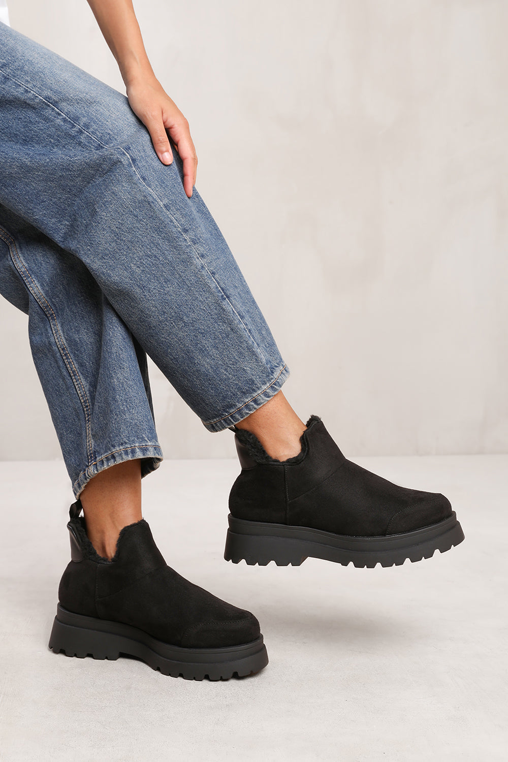 NANCIE LOW ANKLE BOOT WITH FAUX FUR LINING AND CHUNKY SOLES IN BLACK SUEDE