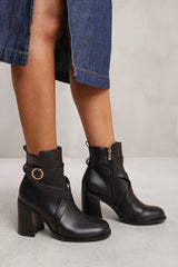 TEAGAN ANKLE BOOT WITH CHUNKY HEEL AND CROSS OVER STRAP DETAIL IN BLACK FAUX LEATHER