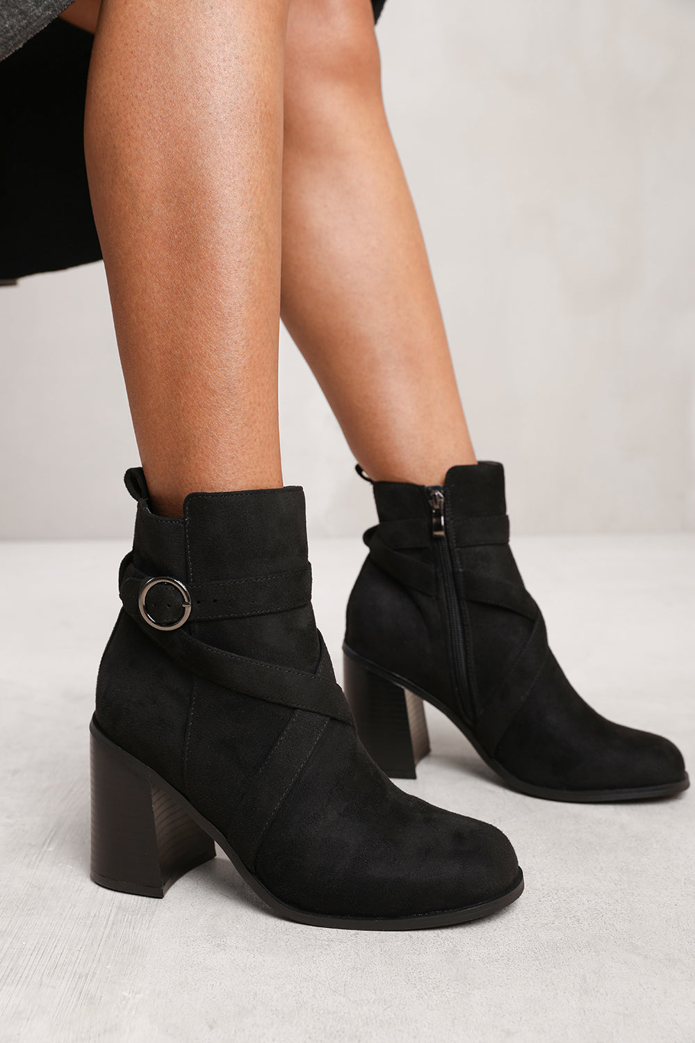 TEAGAN ANKLE BOOT WITH CHUNKY HEEL AND CROSS OVER STRAP DETAIL IN BLACK SUEDE