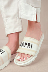MOON FLAT SANDAL WITH TEXT DETAILING AND PRINTED SOLE IN CREAM