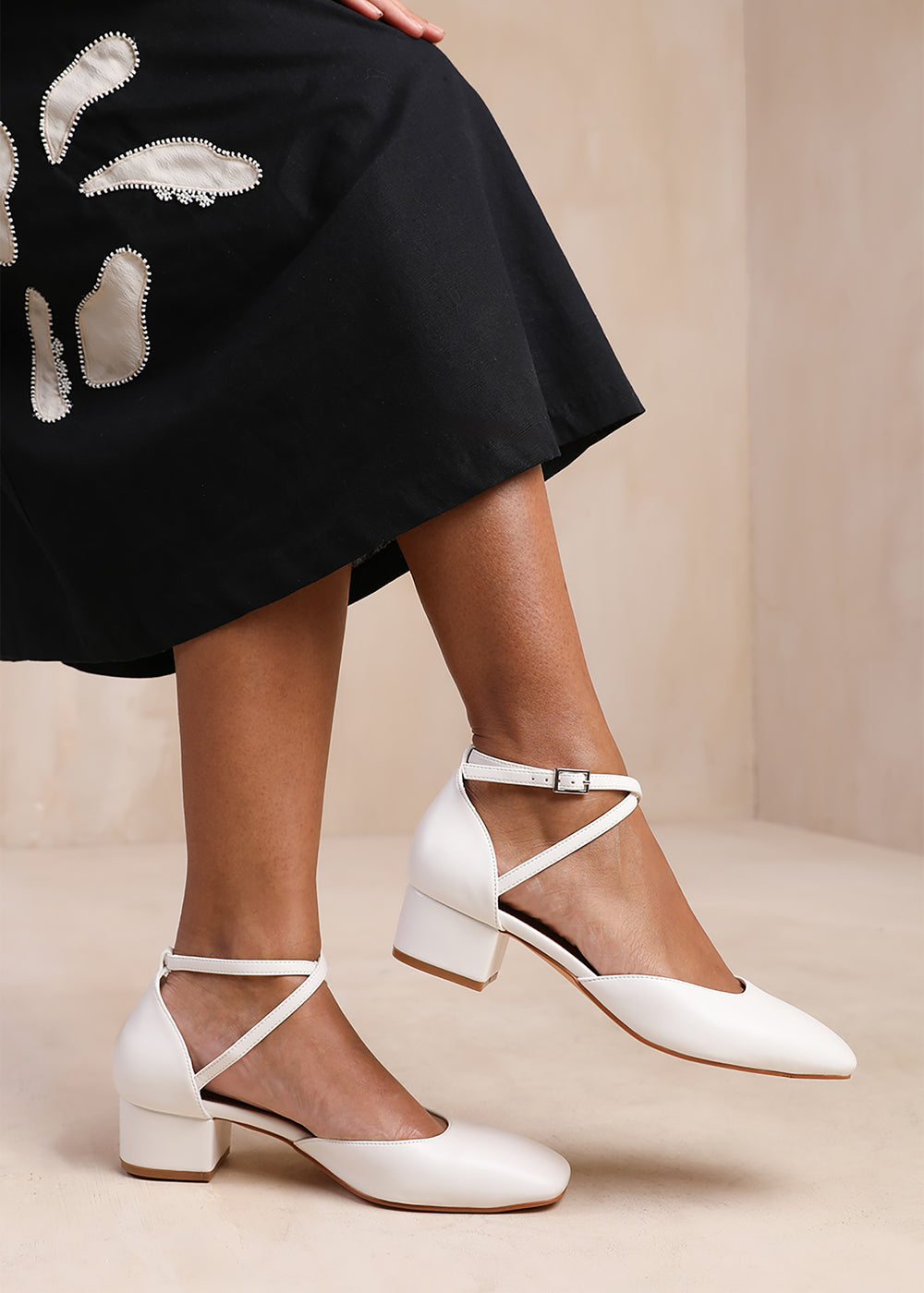 PERU CROSS OVER ANKLE STRAP LOW BLOCK HEEL IN WHITE FAUX LEATHER