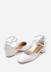 PERU CROSS OVER ANKLE STRAP LOW BLOCK HEEL IN WHITE FAUX LEATHER