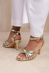 SMARA MULTI CROSS OVER STRAP MID HEELS IN GOLD FAUX LEATHER