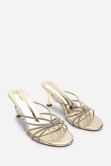 Pyris Diamante Multi Strap Knot Mules In Gold Metallic