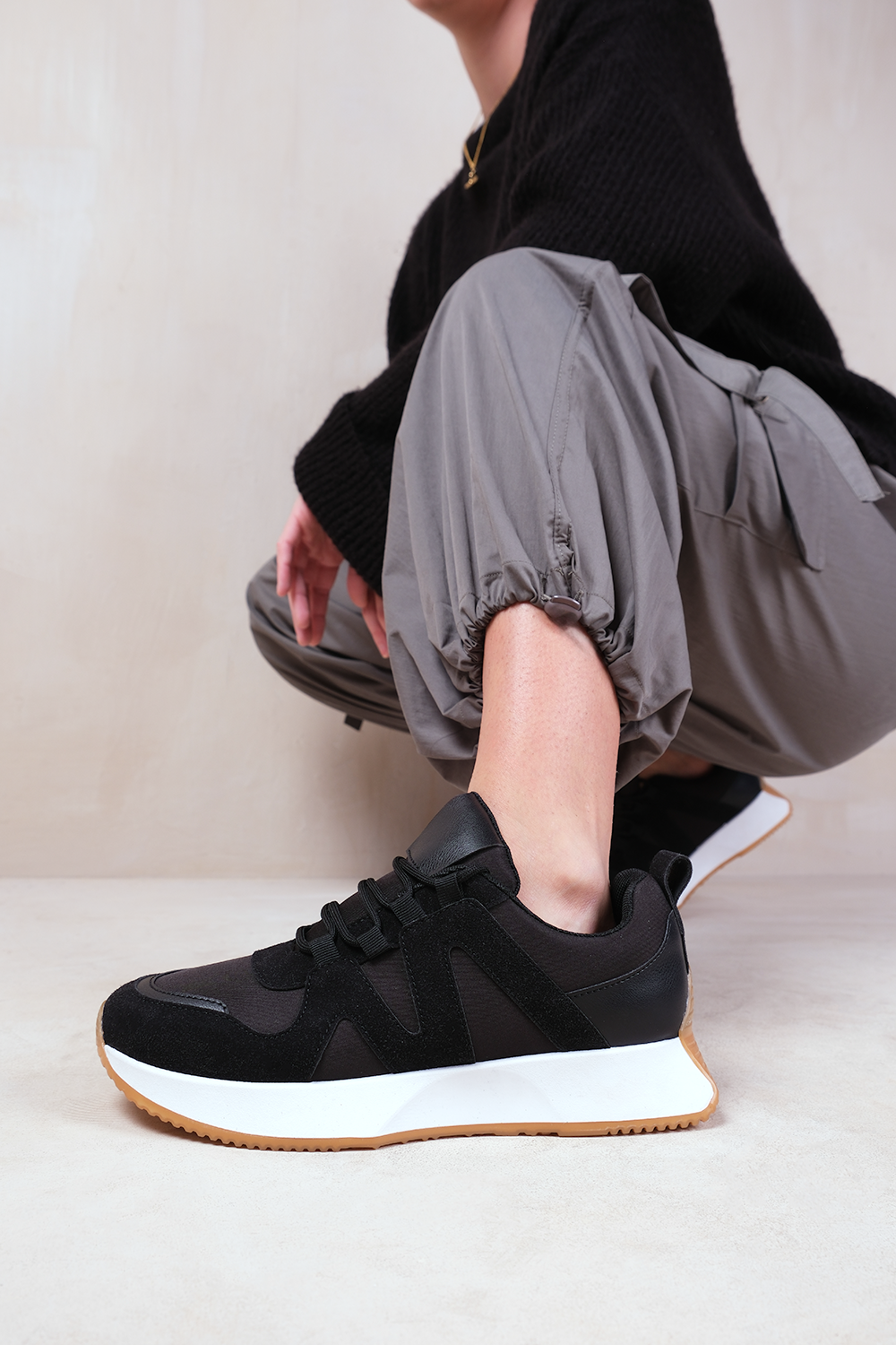 MOMENTUM RUNNER SNEAKER TRAINERS WITH SUEDE DETAIL IN BLACK FAUX LEATHER