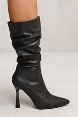 MAEVE MID CALF SLOUCH BOOT WITH HIGH HEEL IN BLACK FAUX LEATHER