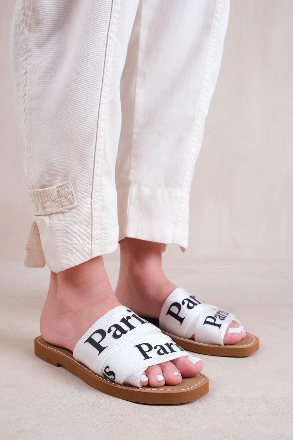 COBRA FLAT SANDALS WITH CROSS OVER BAND IN WHITE FAUX LEATHER