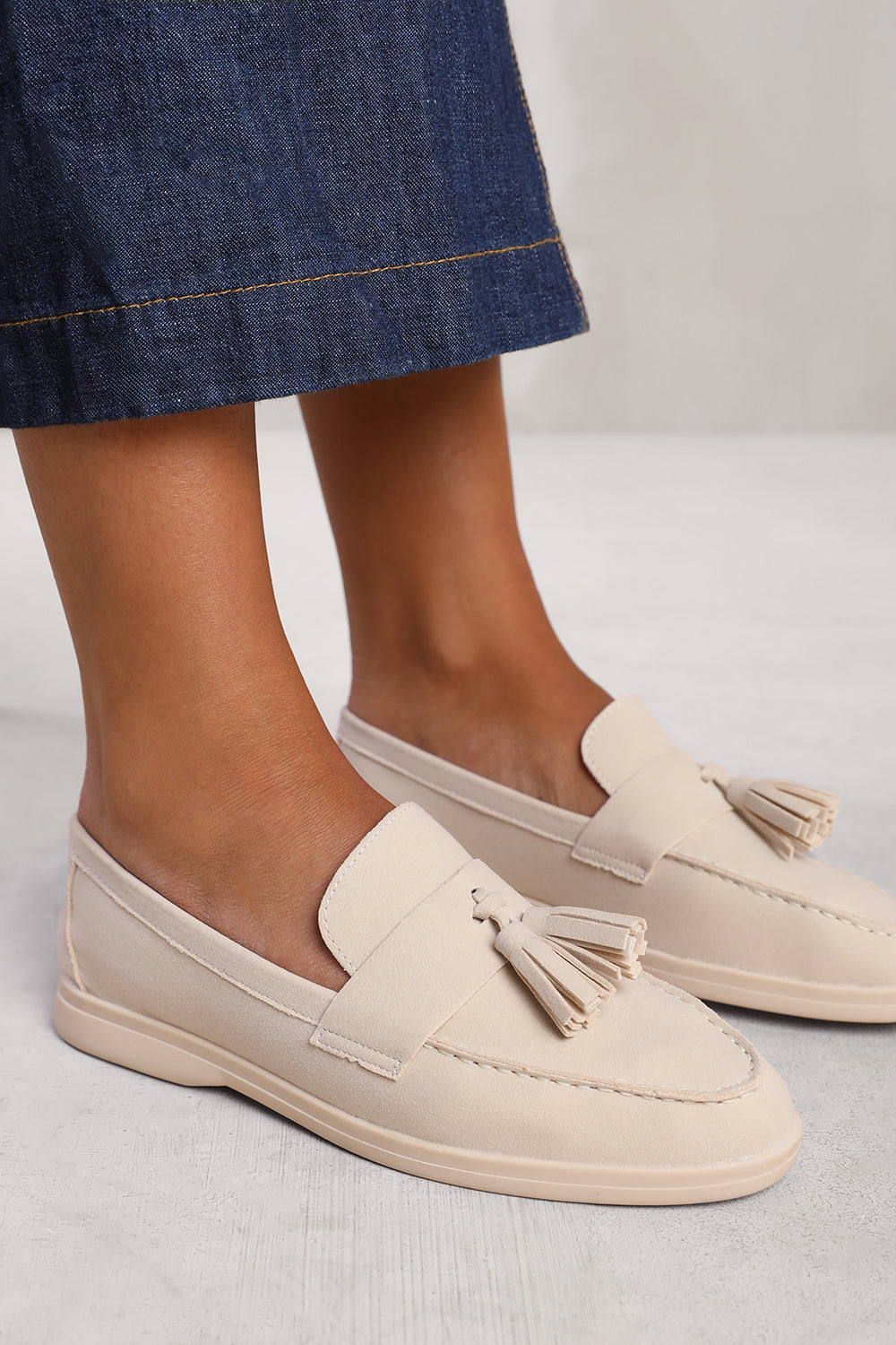 KENYA SLIP ON LOAFER WITH TASSEL DETAILING IN BEIGE SUEDE