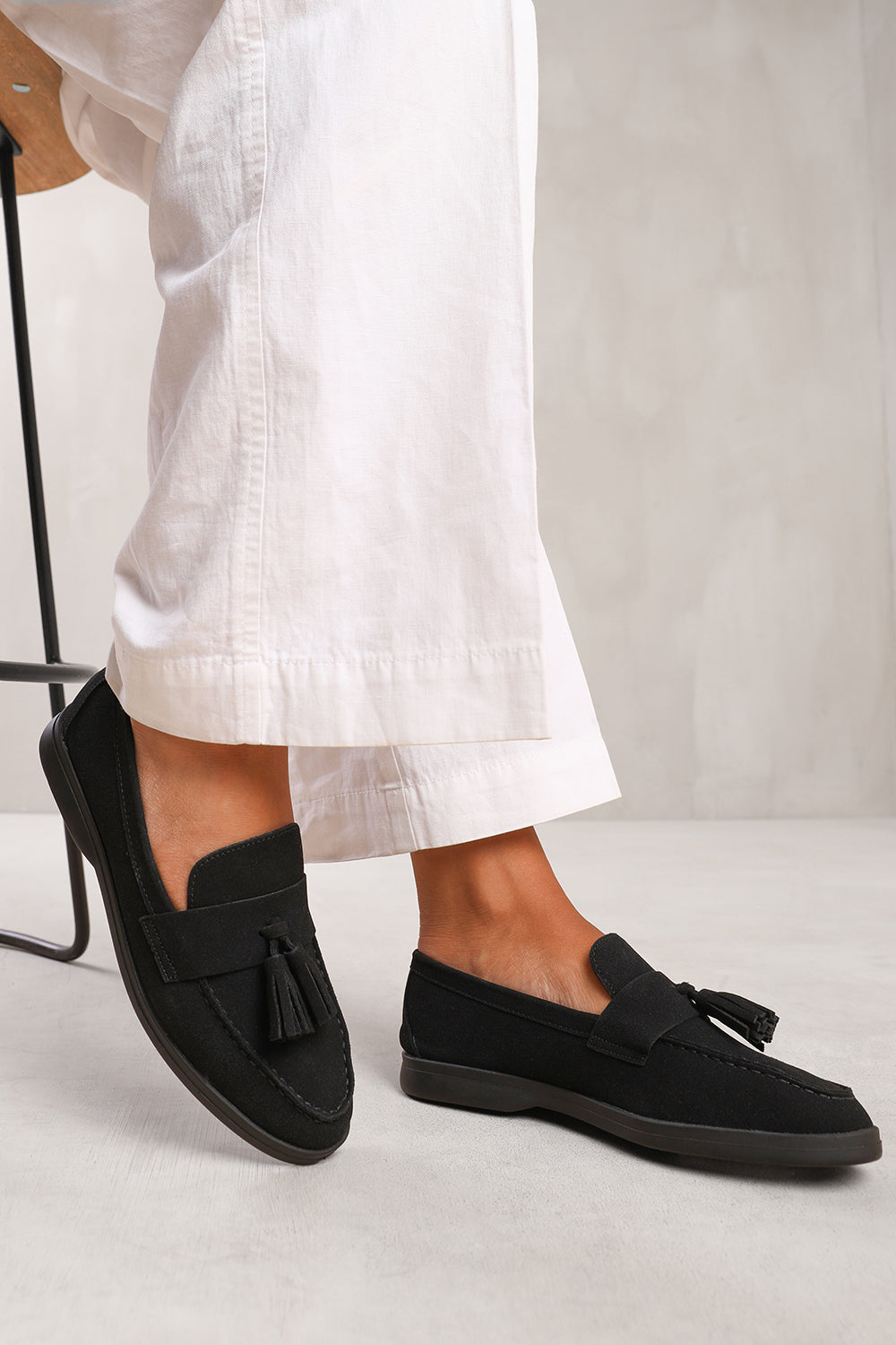 KENYA WIDE FIT SLIP ON LOAFER WITH TASSEL DETAILING IN BLACK SUEDE